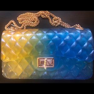 Embossed blue and yellow jelly shoulder bag.